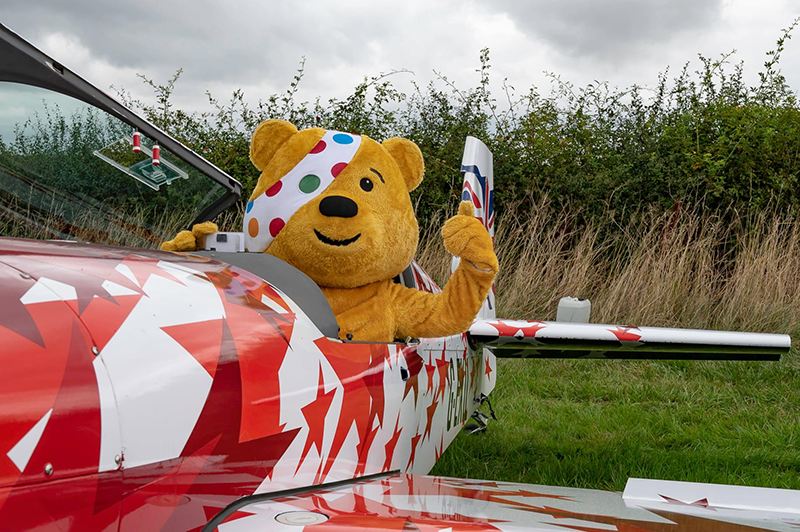 Pudsey Bear in airplane cockpit